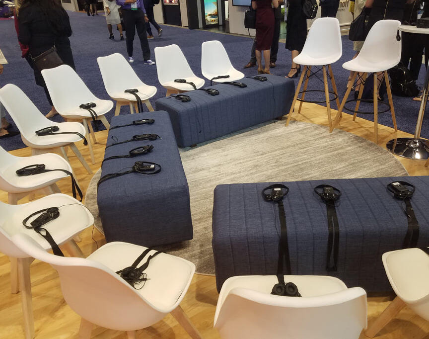 Headsets-on-chairs-at-conference