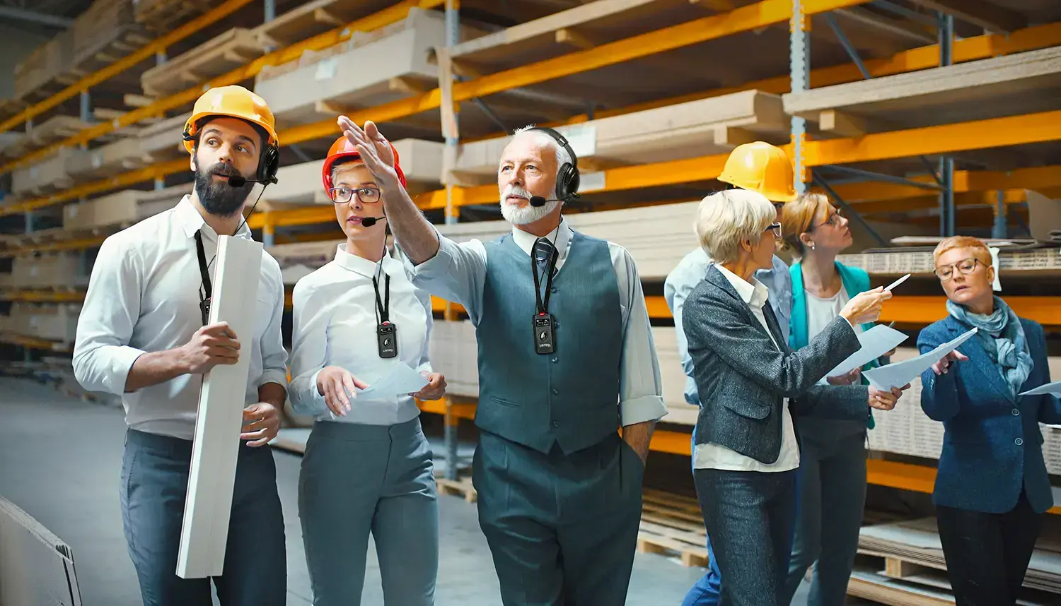 people-wearing-hardhats-and-headsets-on-factory-floor-1